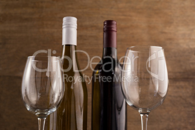 Close up bottles with wineglasses