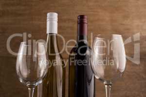 Close up bottles with wineglasses
