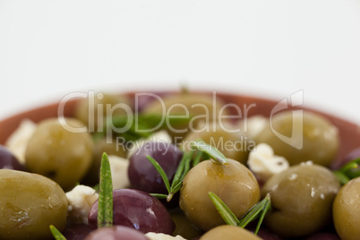 Close up of olives and cheese served in bowl