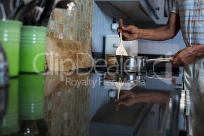 Cropped image of man preparing food