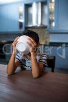 Close up of boy having breakfast at table