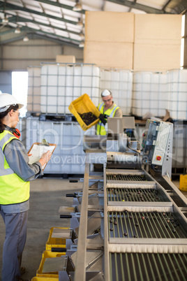 Technician and worker working together