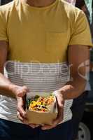 Man holding tortilla in box