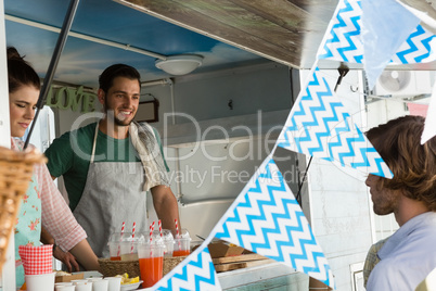 Customer buying food at truck