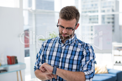 Male executive using smartwatch