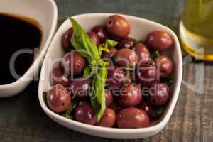 Close up of black olive with herb