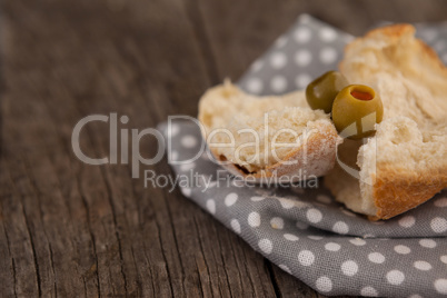 Close up of bread and green olives