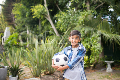 Portrait of boy holding soccer ball