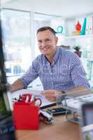 Male executive working at desk in the office