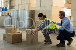 Manager motivating female worker while working