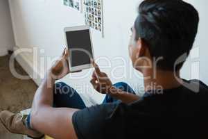 Rear view of man using tablet at office