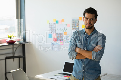 Portrait of confident businessman at office