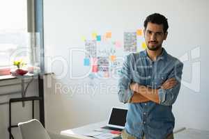 Portrait of confident businessman at office