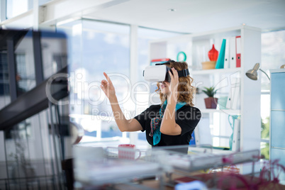 Female designer using virtual reality headset