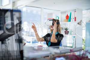 Female designer using virtual reality headset