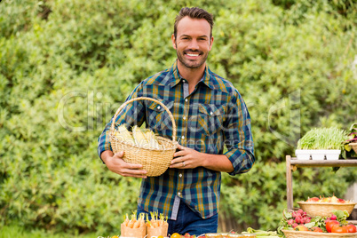 Portrait of happy man selling organic vegetables