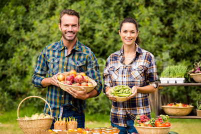 Portrait of couple selling organic vegetables