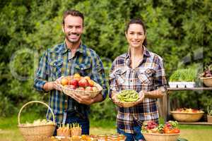 Portrait of couple selling organic vegetables