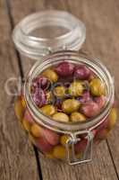 High angle view of olives in glass jar