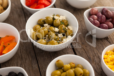 Various olives and ingredients in bowls