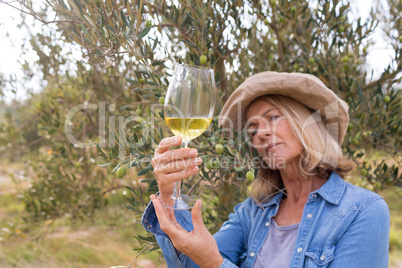 Woman looking at glass of wine