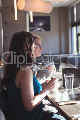 Couple having breakfast in the kitchen