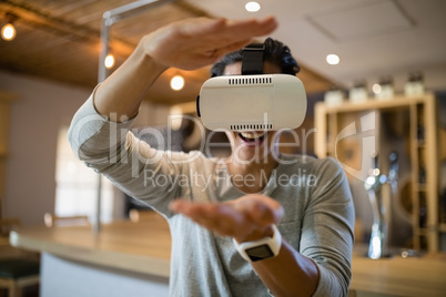 Man using virtual reality headset in restaurant