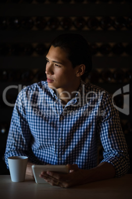 Man holding digital tablet in restaurant