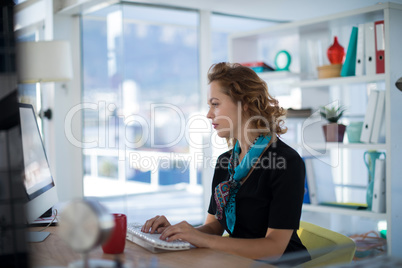 Female executive working on computer