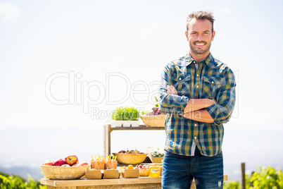 Portrait of smiling man standing at farm