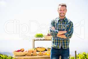 Portrait of smiling man standing at farm