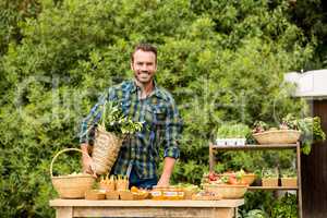 Portrait of smiling man selling organic vegetables