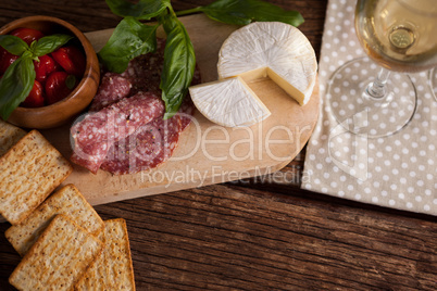 High angle cheese with meat on table