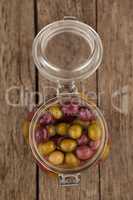 Overhead view of olives in glass jar