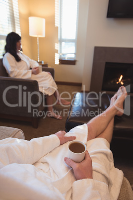 Couple having coffee in the living room