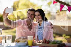 Couple taking selfie on mobile phone