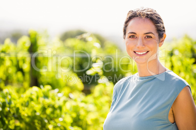 Portrait of smiling woman at vineyard