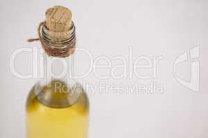 High angle view of olive oil bottle with cork