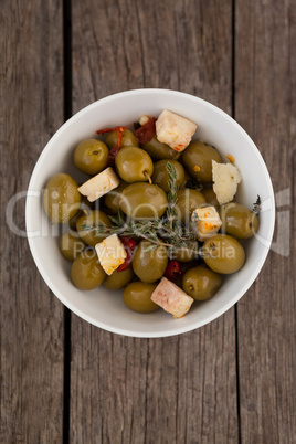 Directly above shot on olives with cheese served in bowl