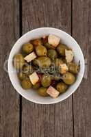 Directly above shot on olives with cheese served in bowl
