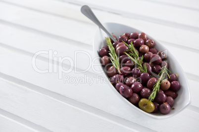 Olives garnished with rosemary