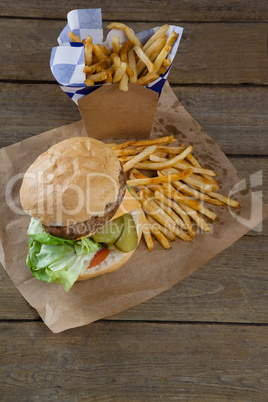 Overhead of hamburger and french fries in take way bag