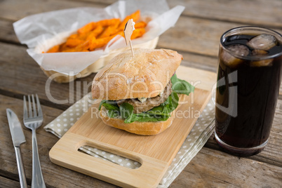 Close up of hamburger with french fries and drink