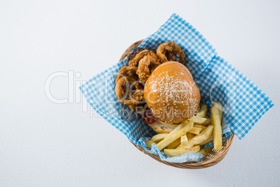 Burger and French fries with onion rings