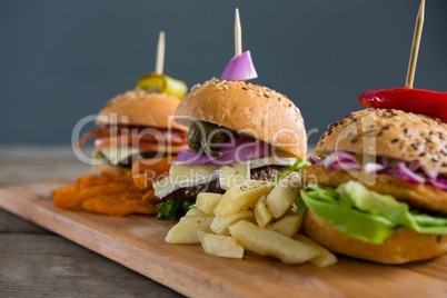 Close up of Various burgers with French fries