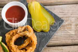 High angle view of vegetable with onion ring and sauce