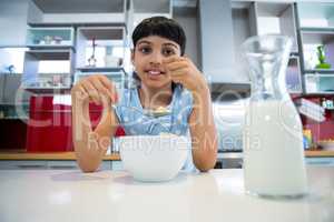 Portrait of girl eating healthy breakfast