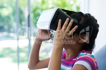 Side view of girl wearing virtual reality simulator