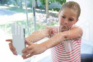 Close up of girl photographing with smartphone