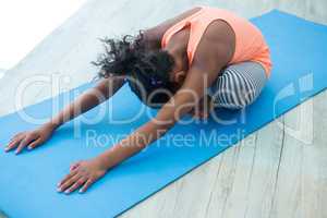 High angle view of girl exercising in room